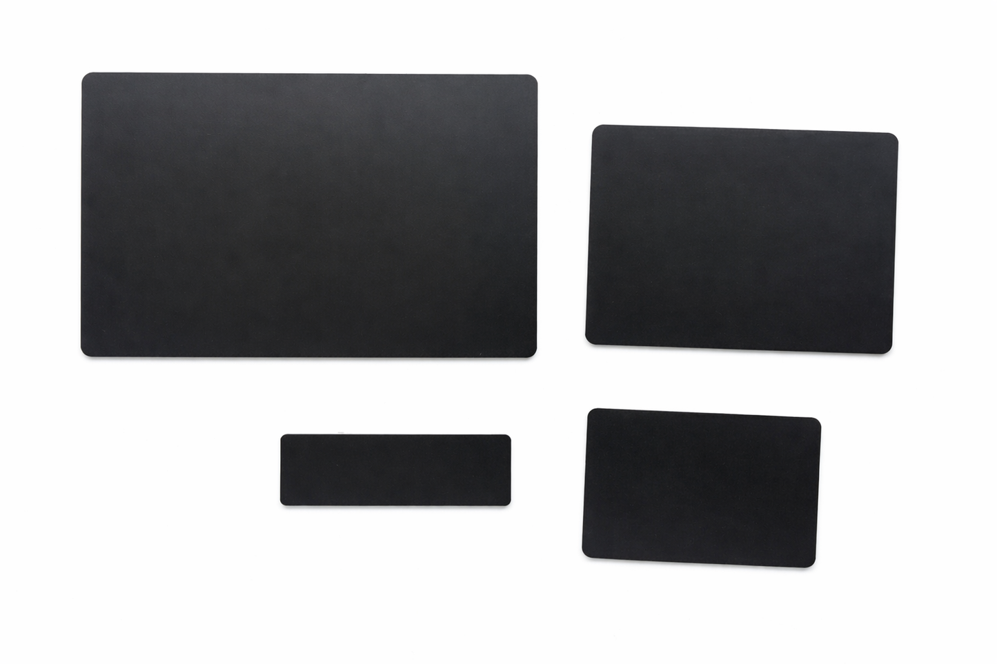 Set of four black rectangular labels on a white background