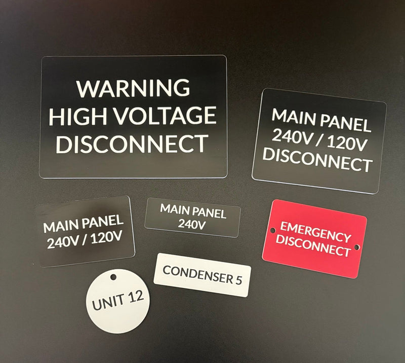 Custom engraved electrical panel labels made from two-tone acrylic for breaker boxes, disconnect switches, meters, and equipment identification