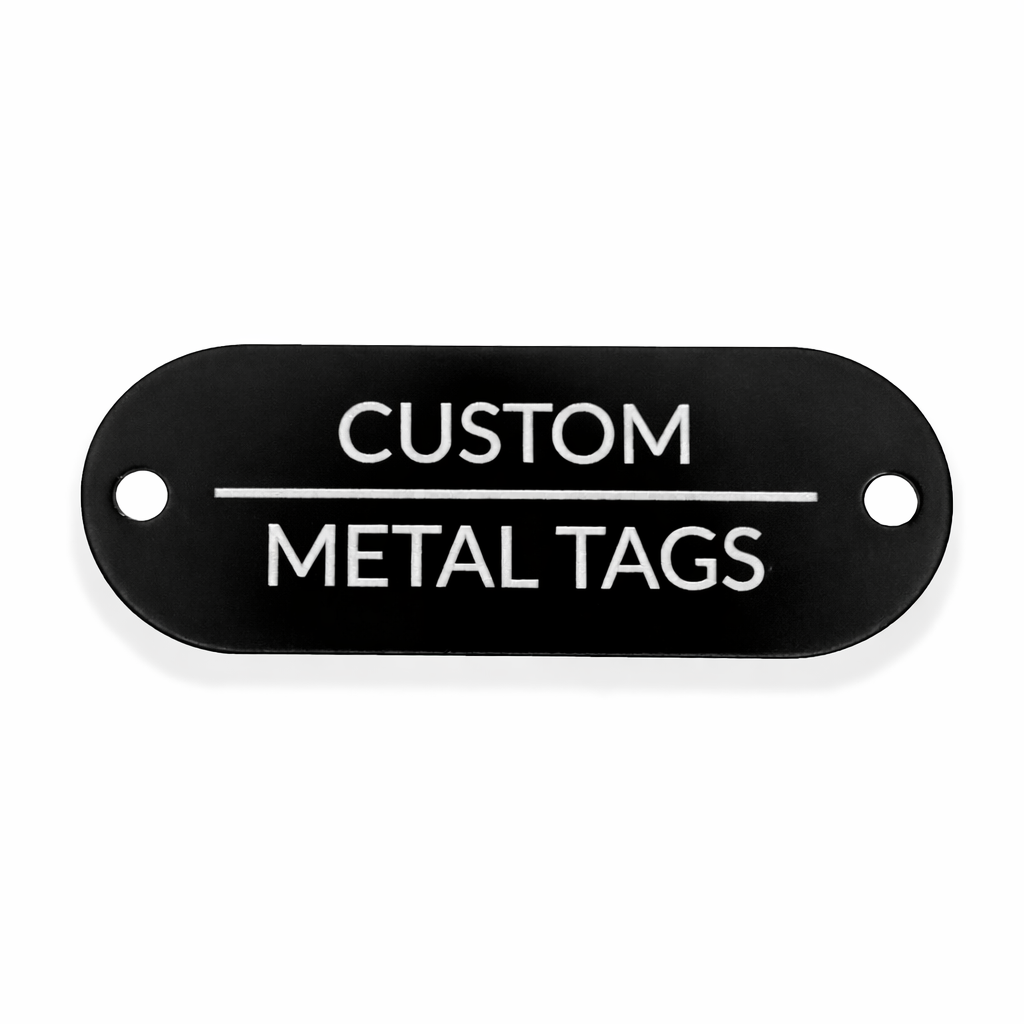Black metal tag with 'Custom Metal Tags' text on a white background